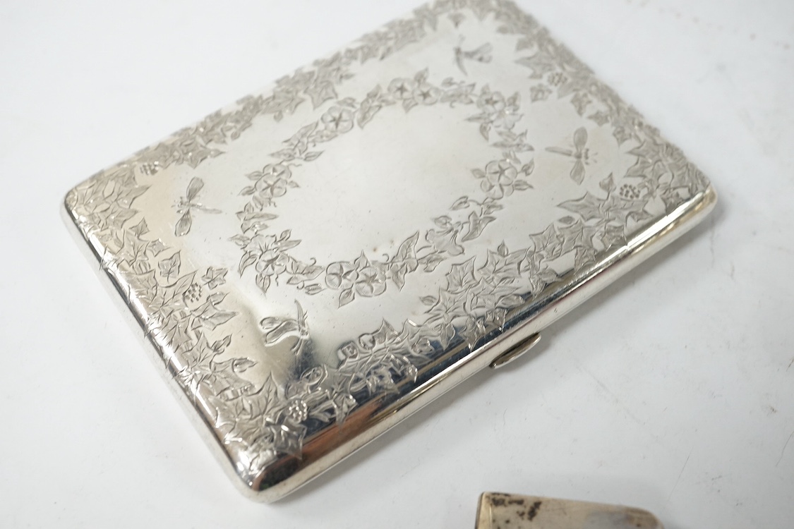 A late Victorian engraved silver card purse, by William Summers, London, 1880, 10cm, together with a similar wrythened silver card purse, Birmingham, 1892 and a small late Victorian silver card case. Condition - fair to